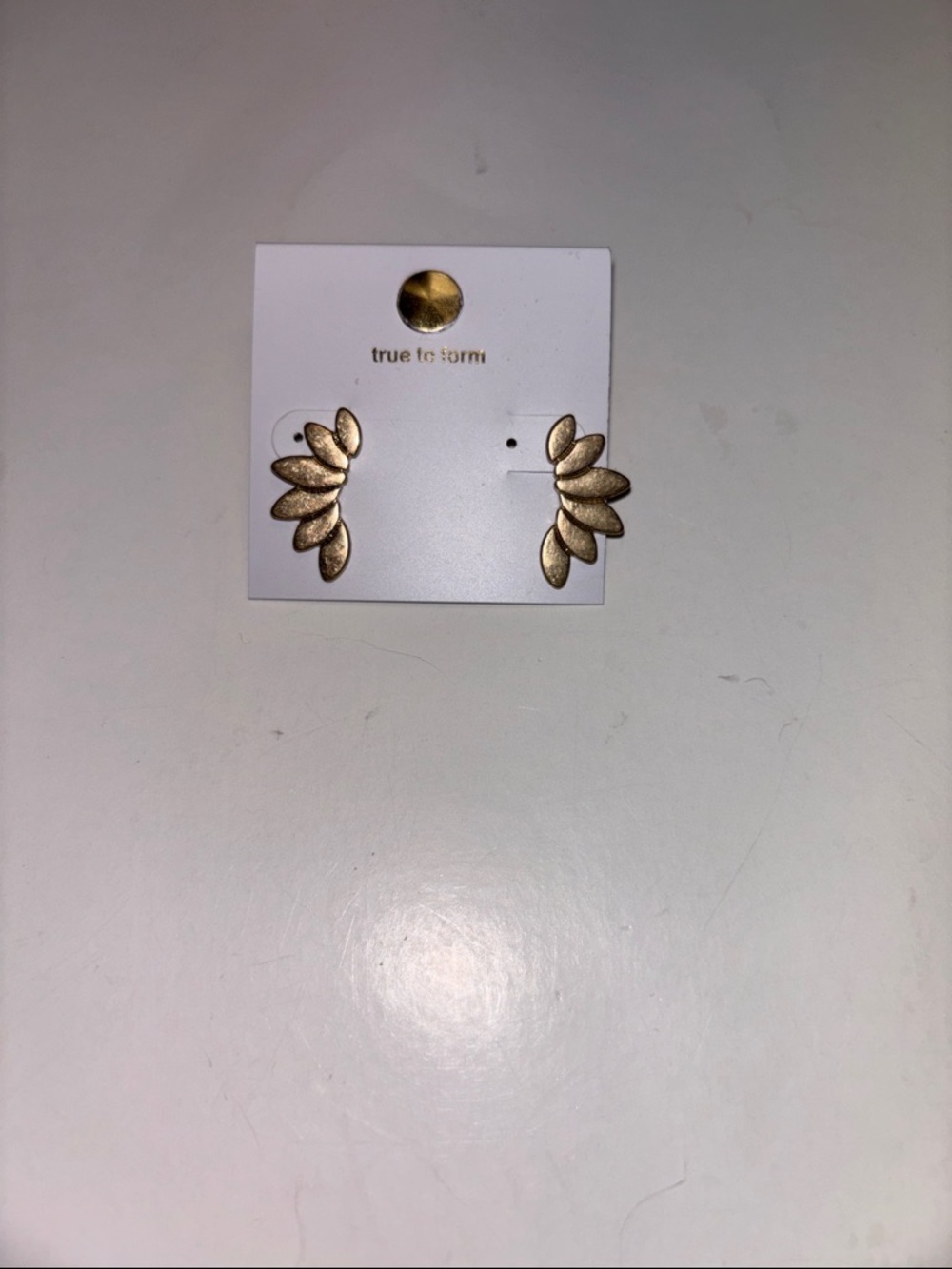 Gold toned 1 inch Wing stud earrings